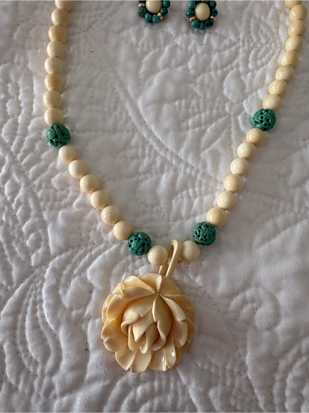 Cream Beaded Necklace with Green Accent Beads and Floral Pendant